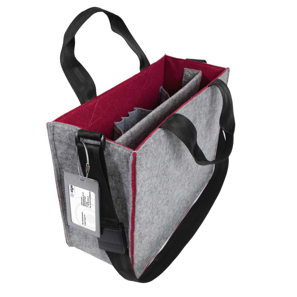 Grey felt bag with red insides, black handles and lapel card