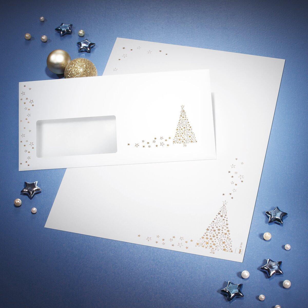 Envelope and paper with golden stars on blue background Decorated with pearls and silver stars