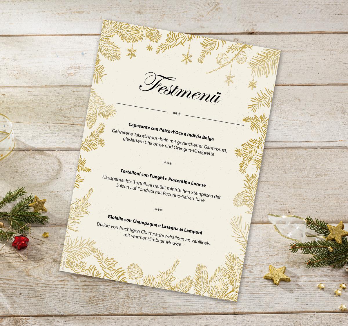 Festive menu on a wooden background, decorated with golden fir branches and stars