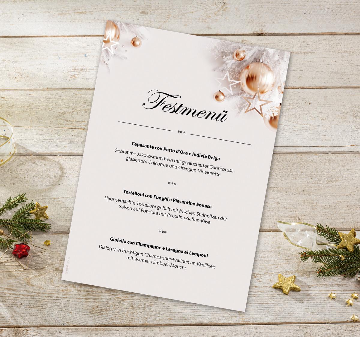 Festive menu card on wooden table with fir branch and golden stars