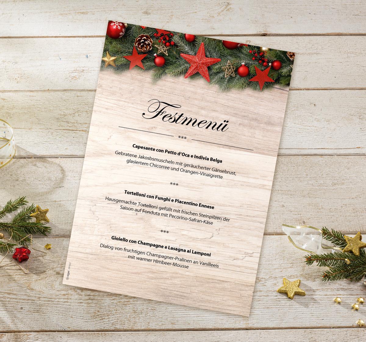 Christmas menu on a wooden background, decorated with fir branches and red baubles