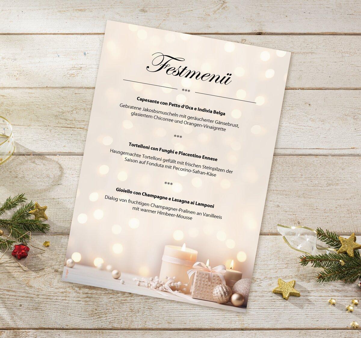 Festive menu card with candles and Christmas decoration on wooden table