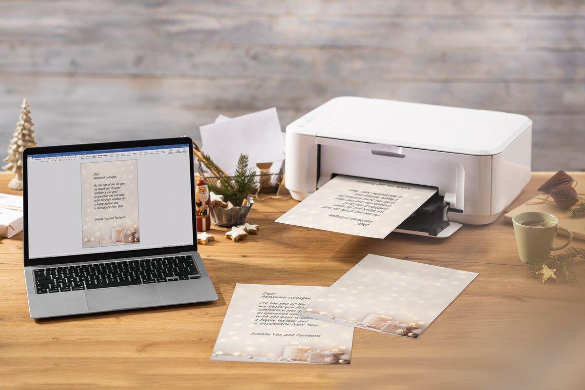 Laptop and printer on table