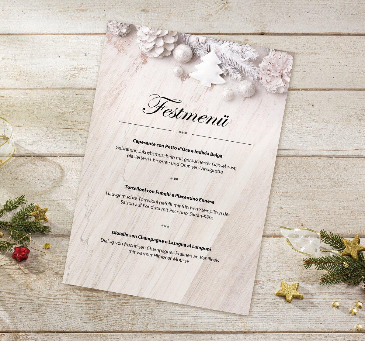 Festive menu card on wooden background, decorated with fir branches and decoration