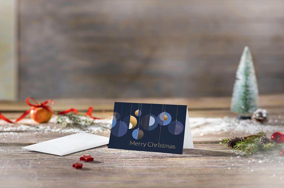 Christmas card with baubles, Christmas tree on the left