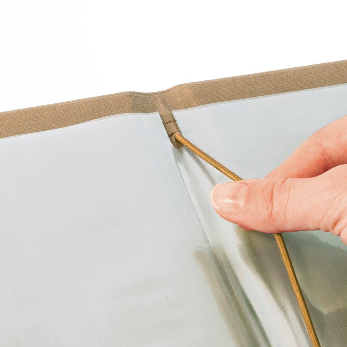 Finger stretches tent pole in loop