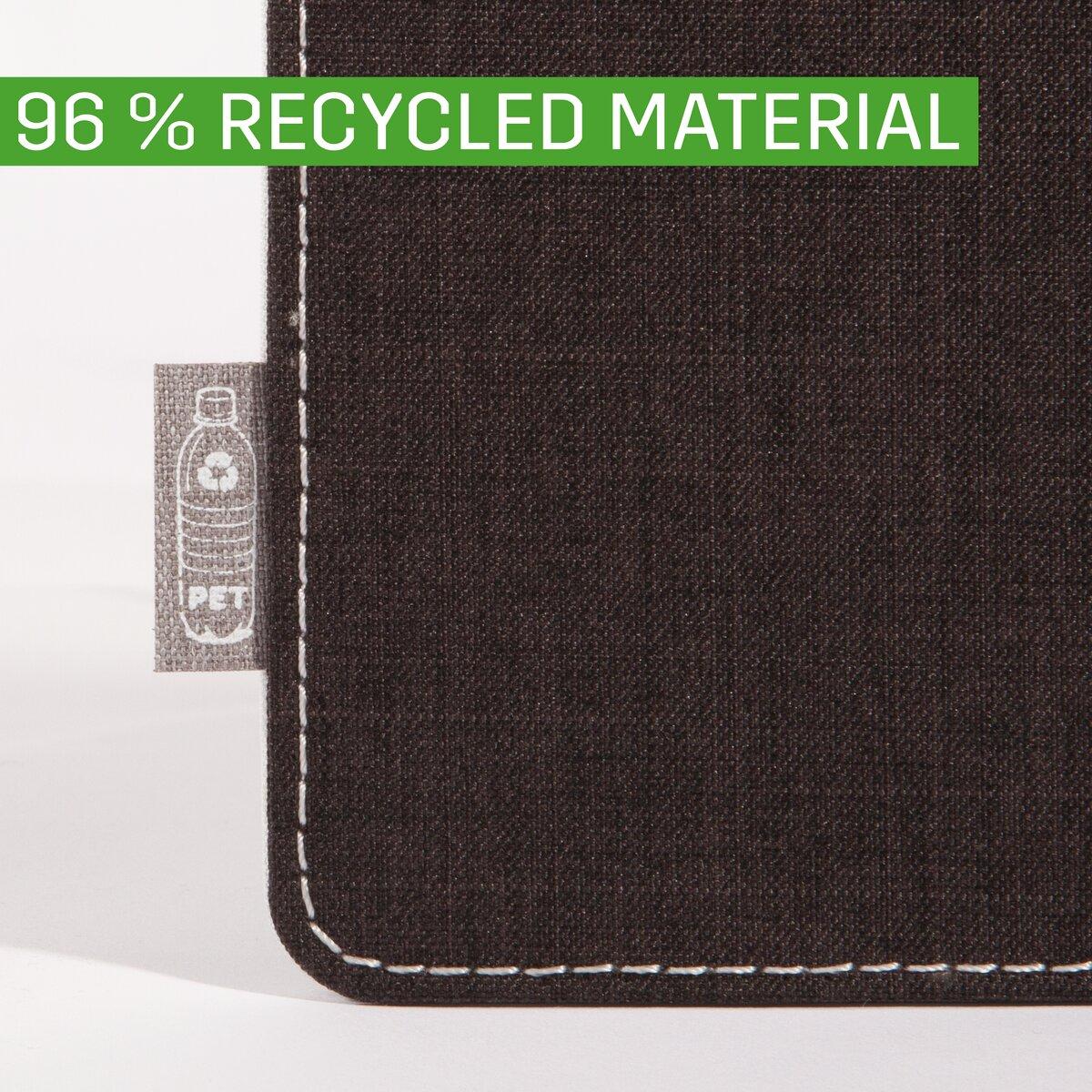 Corner of a black bag with PET label, inscription: 96% RECYCLED MATERIAL