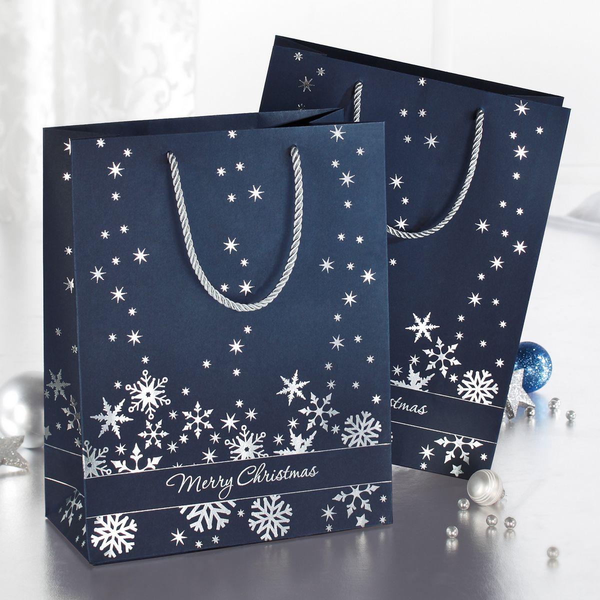 Blue gift bags with snowflakes and Merry Christmas lettering