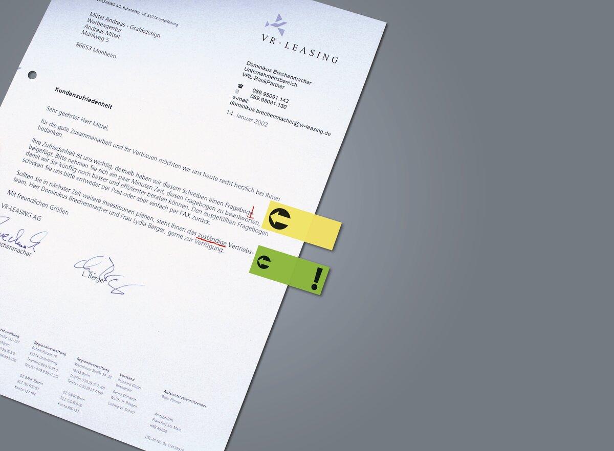 Letter marked with customer satisfaction text, yellow and green arrow