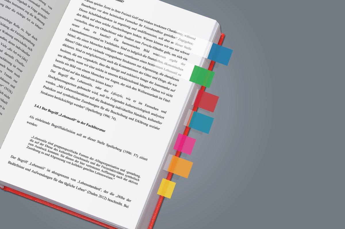 Open book with colorful markings