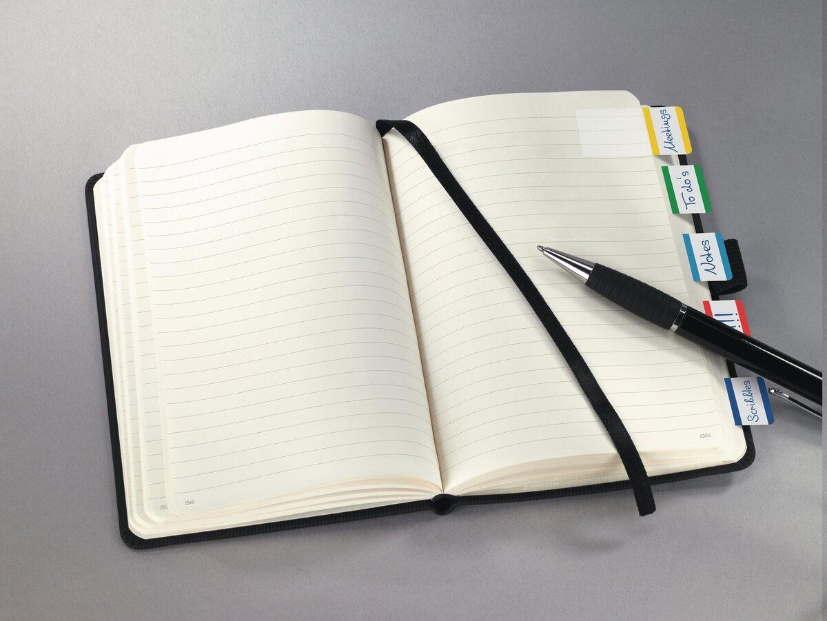 Notebook with tabs, ballpoint pen lies on it