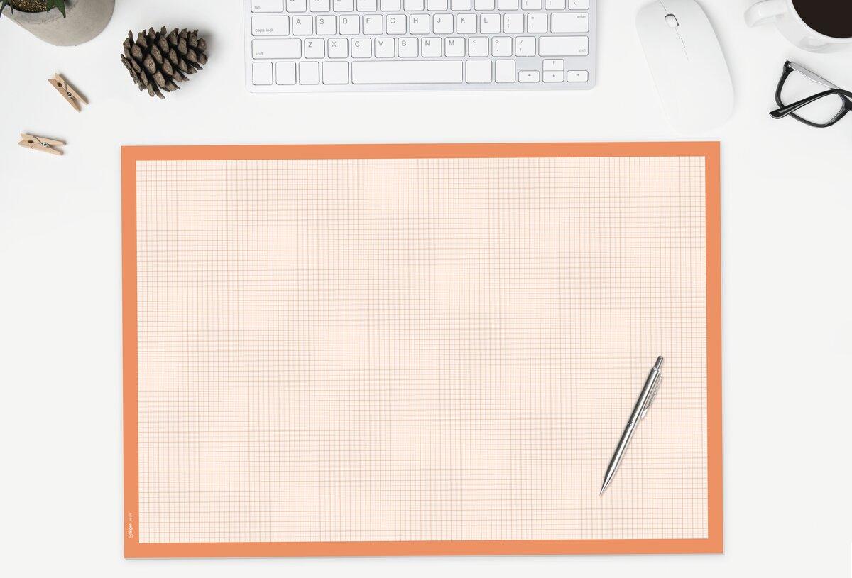Checkered paper with pen, keyboard and glasses on desk