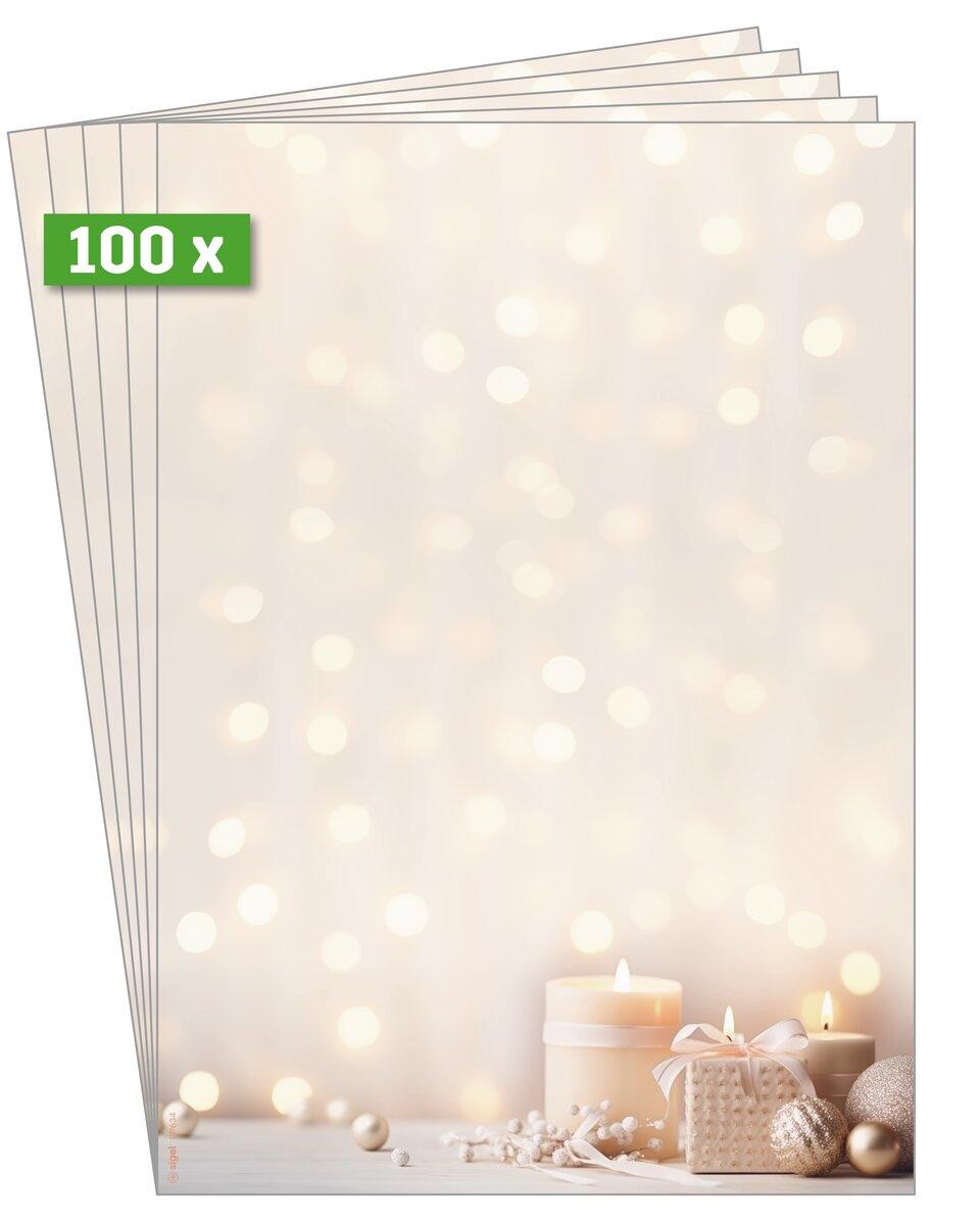 Candles and gifts in front of blurred lights background