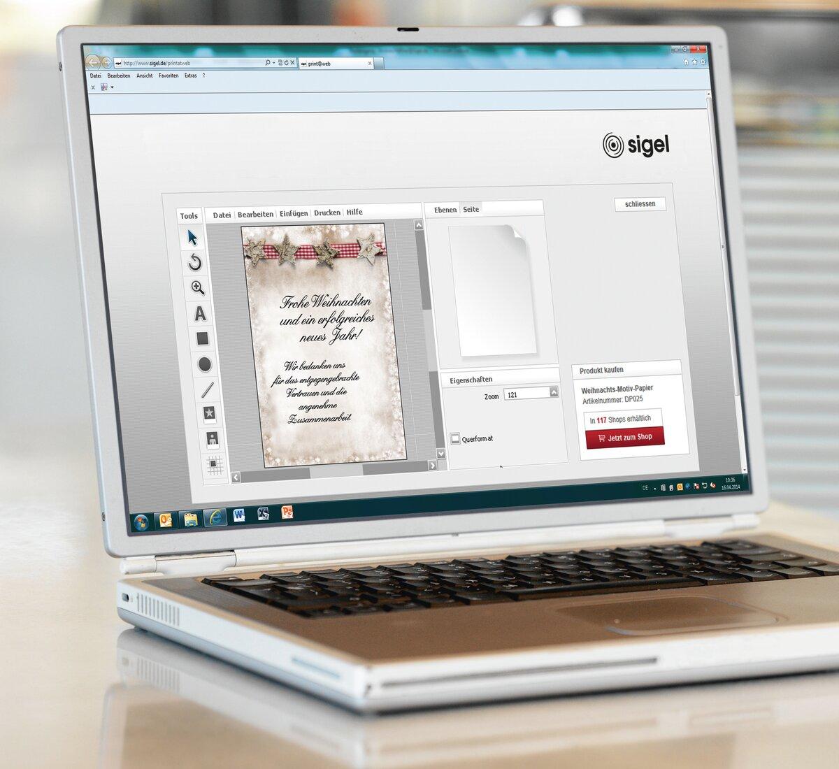 Laptop with Christmas card design on screen