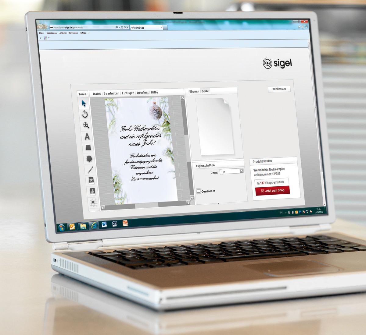 Laptop showing an open program with Christmas card in draft
