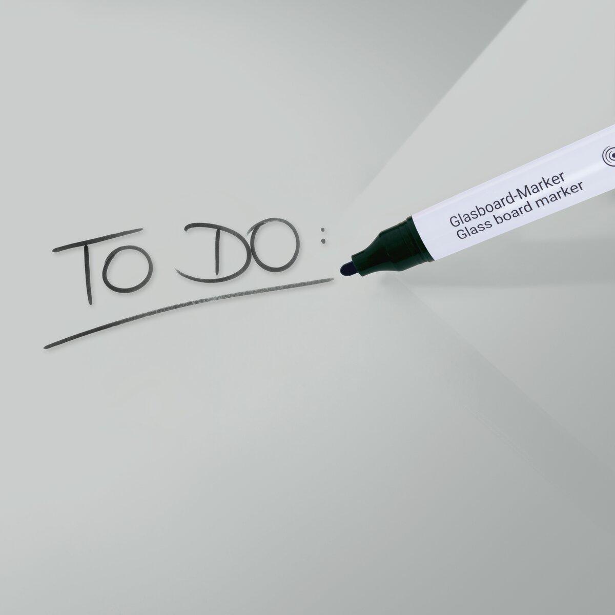 To-do list written on glass marker near