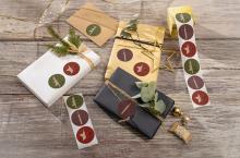 Christmassy wrapped gifts with twigs and decorative stickers