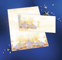 Shining stars on a golden background, in the foreground and scattered on a blue background