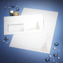 Envelope and paper with golden stars on blue background Decorated with pearls and silver stars