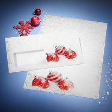 Envelope with red Christmas balls on blue background Matching card with snowflake pattern