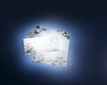 Envelope and card with winter motif, snowflakes and balls on blue background