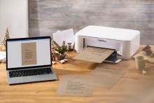 Laptop and printer on table