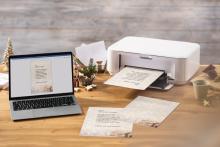 Laptop and printer on table