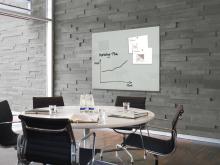 conference table with chairs; Whiteboard with graph