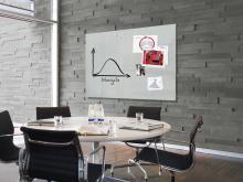 conference table with chairs; Whiteboard with diagram on the wall