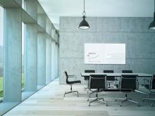 Modern conference room, blank blackboard, black chairs