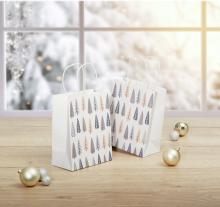 White Gift Bags with Tree Pattern, Golden and Silver Balls on Wooden Surface, Blurred Snow Background