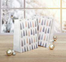 Paper bags with leaf pattern in front of window, golden balls