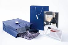 Blue Gift Bags with Shirt, Wine and Cookie Box Card in a White Envelope
