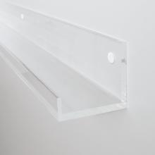 Clear Plastic Shelf on White Wall