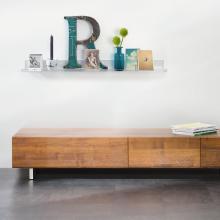 Wooden shelf and white wall with decoration