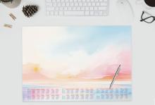Pastel Colored Wall Calendar with Ballpoint Pen on Desk Top Keyboard, Cup, Glasses, Pine Cones