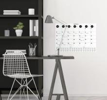 Desk with lamp, calendar on the wall