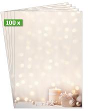 Candles and gifts in front of blurred lights background