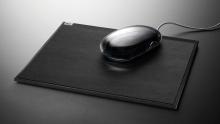 Black computer mouse on pad