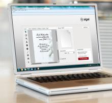 Laptop with open Christmas card preview