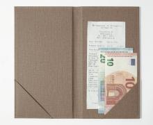 Receipt and euro banknotes in brown folder