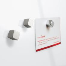 Two silver magnets and card