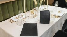 Elegantly set table with menu cards