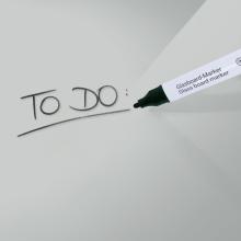 To-do list written on glass marker near