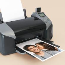 Printer with photo printout of a smiling couple