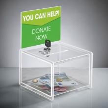 Donation box with money and Donate Now sign