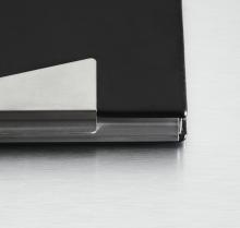 Black laptop corner detail on silver background